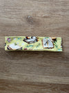 Fabric strip with book-themed design on a wooden surface workout headband for readers too. 