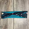 Dark Blue background with cream and pink flowers scattered throughout the serotonin molecule  with a teal moisture wicking underneath to match