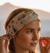 Woman with Camper van and tents scattered throughout the RV headband