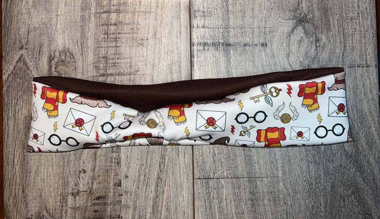 Handmade double-sided workout headband with wizard themed print on white and solid brown fabric