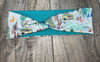 Handmade workout headband with camping-themed illustrations and teal fabric from Athena Fitness Collections