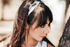 Close-up of woman wearing handmade black and white workout headband 