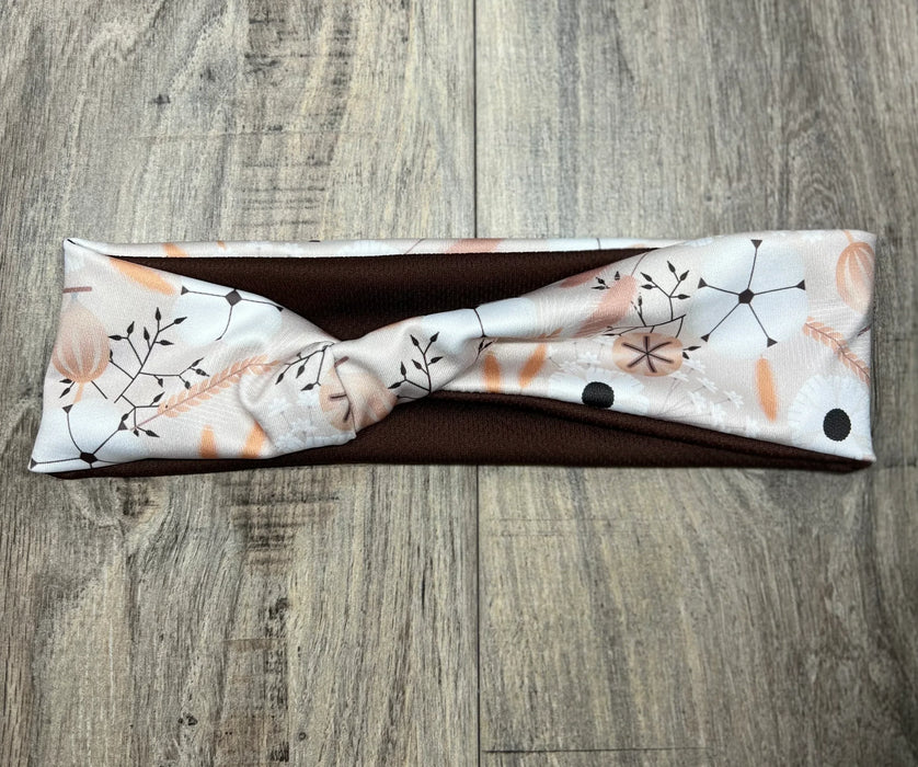 Floral handmade workout headband with twisted knotted dandelion print