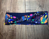 Athena Fitness stylish workout headband with colorful space and star print on wooden background