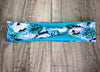 Light Blue Headband with white flowers and green flora with light blue dri fit material 