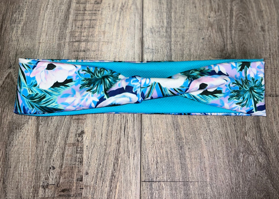 Light Blue Headband with white flowers and green flora with light blue dri fit material 