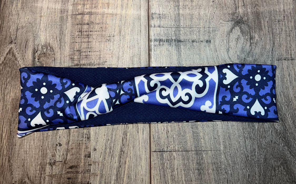 White Blue and Black floral medallion design with royal blue moisture wicking underneath