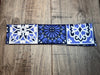 White Blue and Black floral medallion design with royal blue moisture wicking underneath